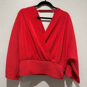 Anthropologie Vibrant Red Wrap Blouse.
PTP 18-20”, Length 21”